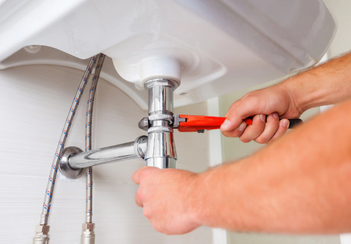 plumber fixing a sink saratoga springs ny